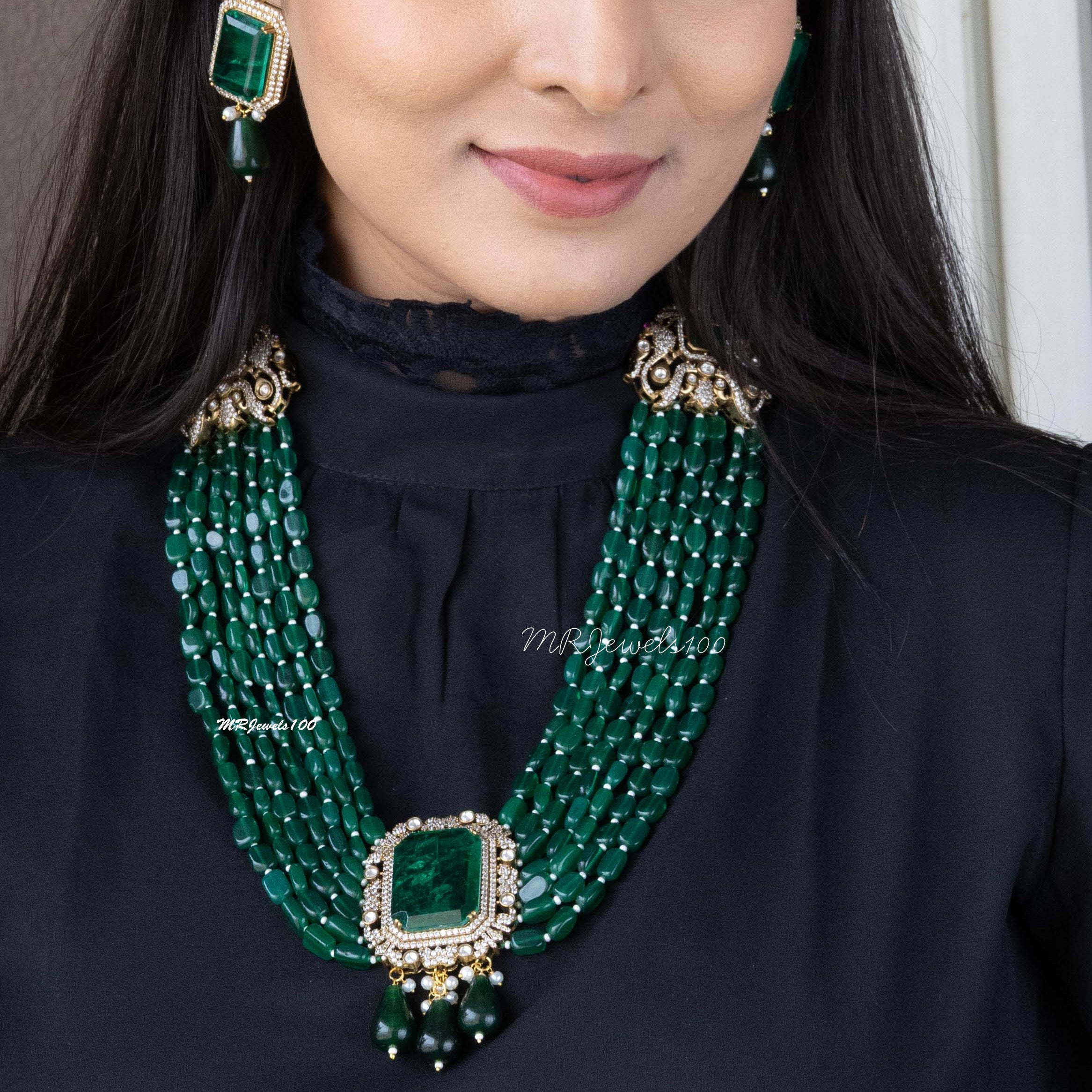 Regal emerald multi-strand necklace, front view with gemstone detail